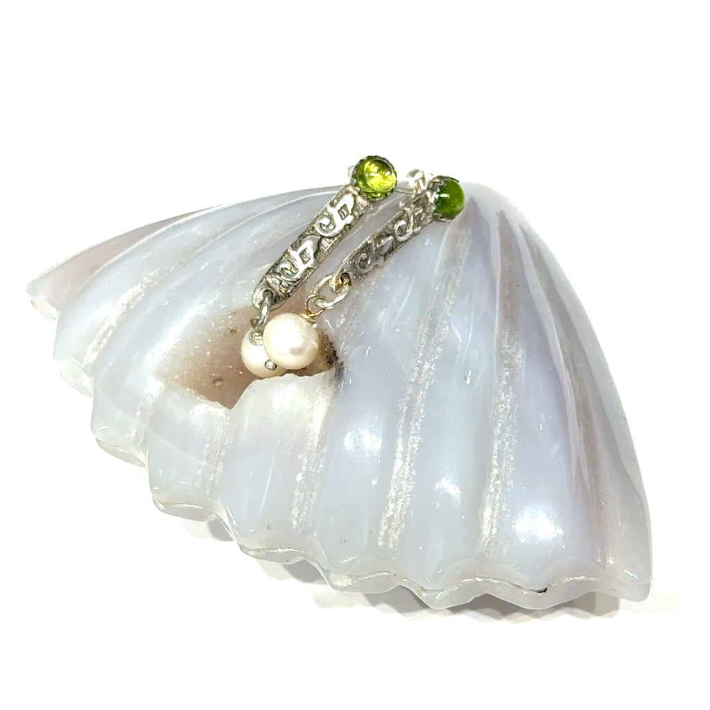 Freshwater Pearl & Peridot Gemstone Earrings with a gemstone shell on white center overview