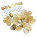 Gemstone rune set with engraved symbols on polished stones, representing divination and reflection golden rutile grouping on white overview