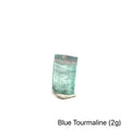 Genuine Blue Tourmaline Raw Gemstone on white 2g front view