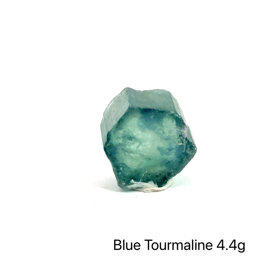 Genuine Blue Tourmaline Raw Gemstone on white 4.4g front view
