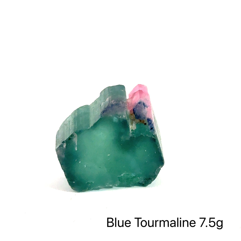 Genuine Blue Tourmaline Raw Gemstone on white 7.5g front view
