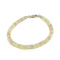 Genuine Ethiopian Opal gemstone bracelet with smooth roundel beads and gold‑filled lobster clasp on white center overview