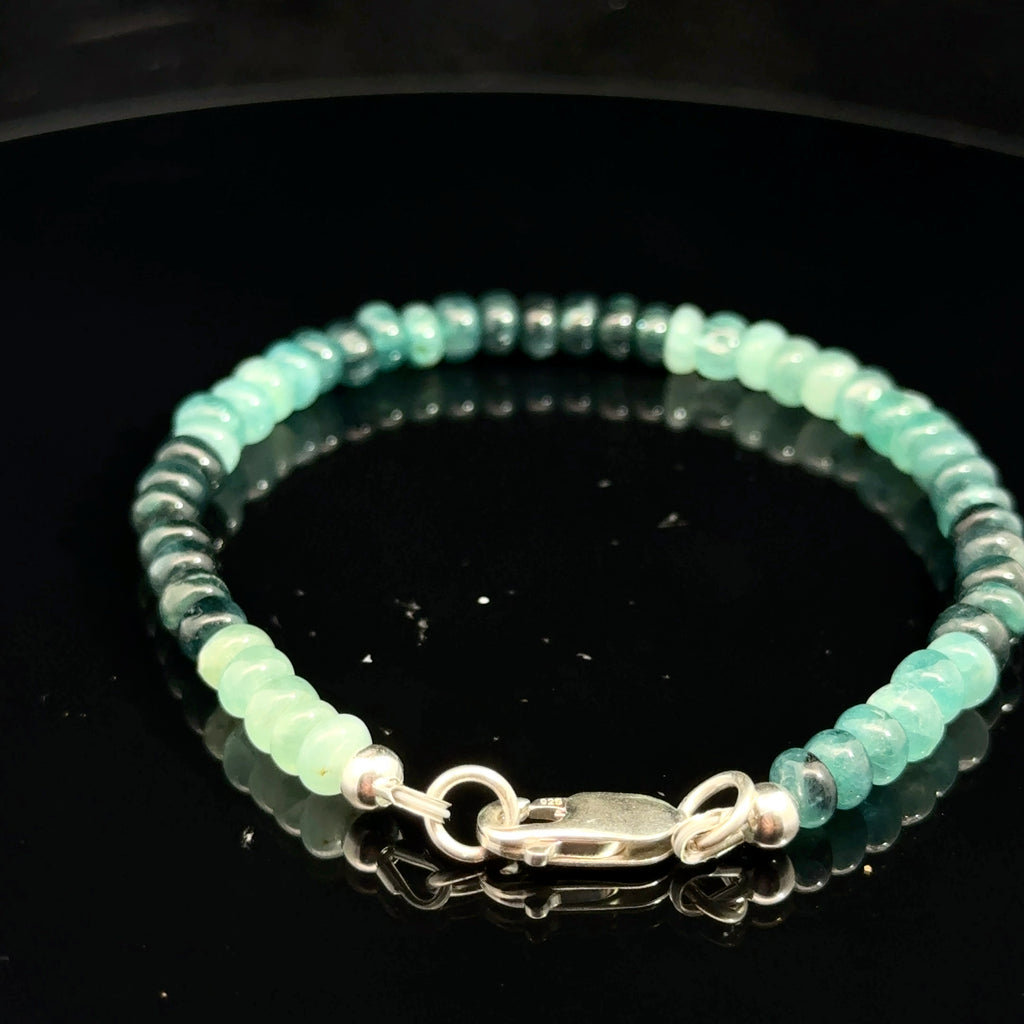 Genuine Grandidierite Gemstone Bracelet  on black back side overview