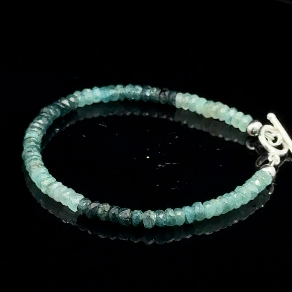 Genuine Grandidierite Gemstone Bracelet  on black front  left side overview