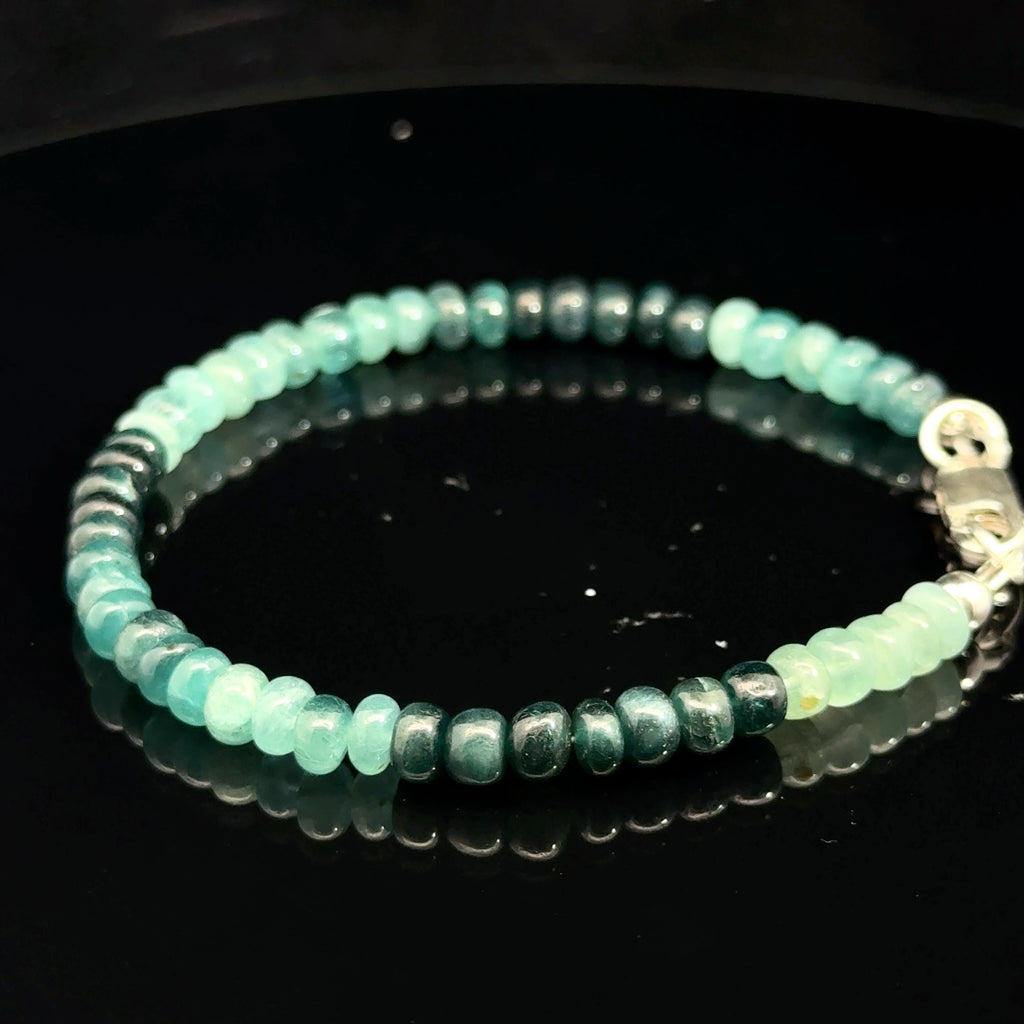 Genuine Grandidierite Gemstone Bracelet  on black left side overview