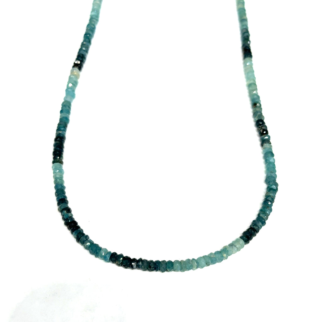 Genuine Grandidierite Gemstone Necklace on white up close up  of hanging center overview