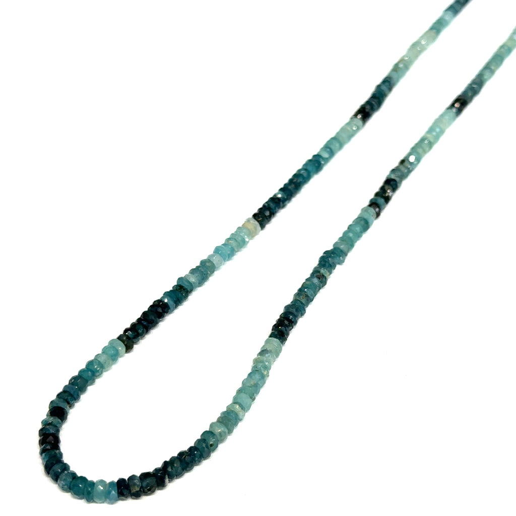 Genuine Grandidierite Gemstone Necklace on white up close up  of hanging right side overview