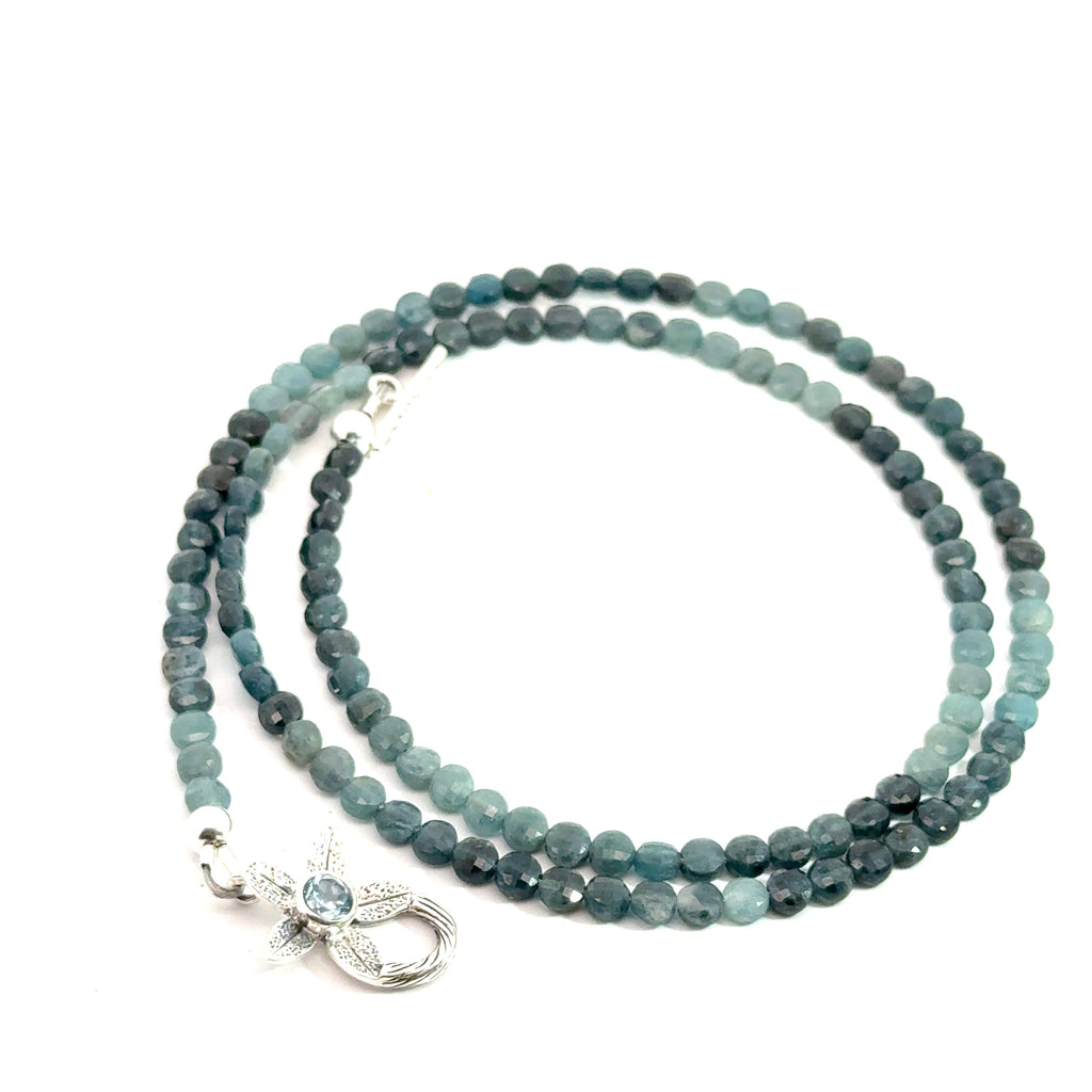 Genuine Grandidierite Gemstone Necklace on white up close up  side of spiral overview