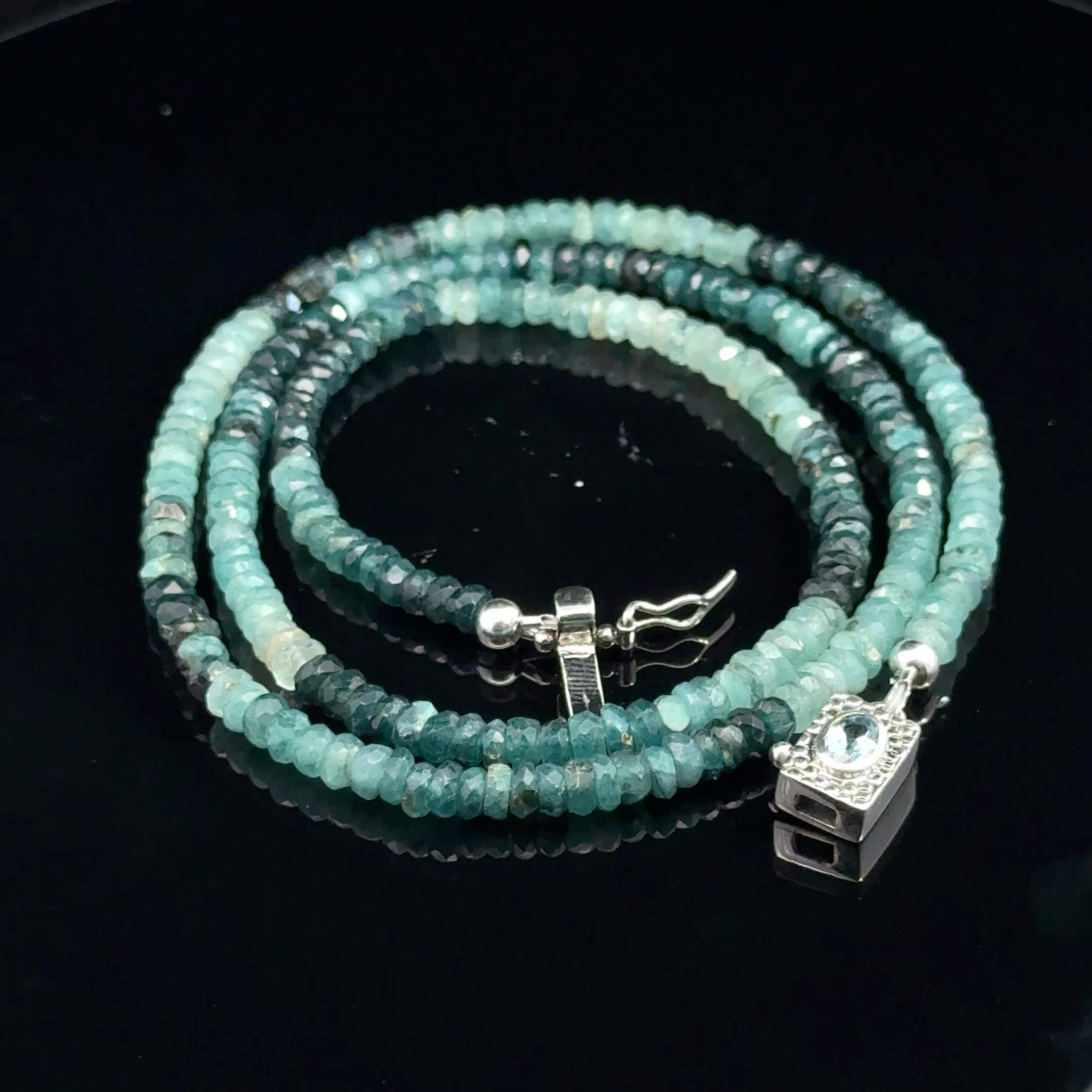 Genuine Grandidierite Gemstone Necklacet on black up close up  of front overview