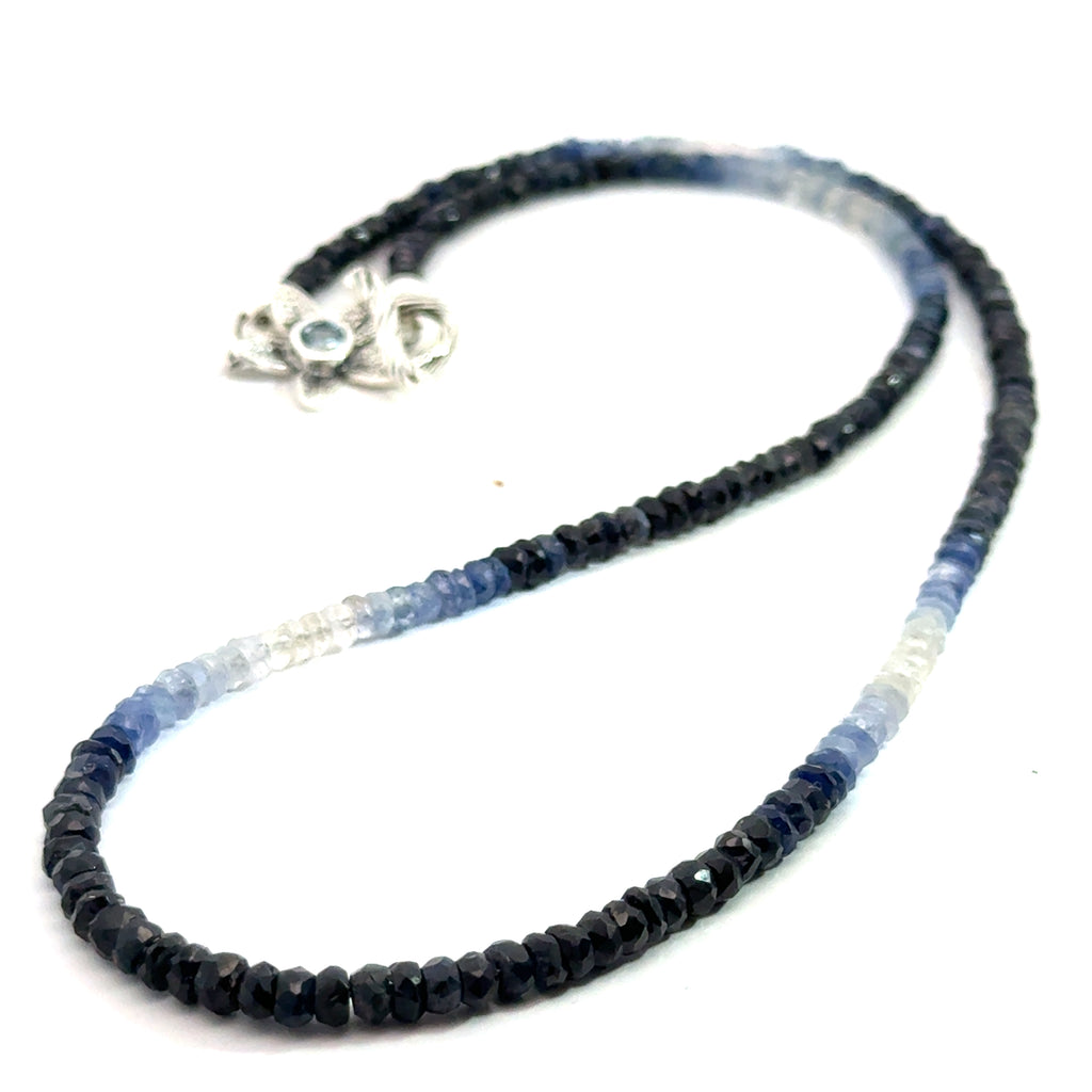 Genuine Sapphire gemstone necklace with a sterling silver toggle clasp by Hidden Jewel on a white background, center-long overview.
