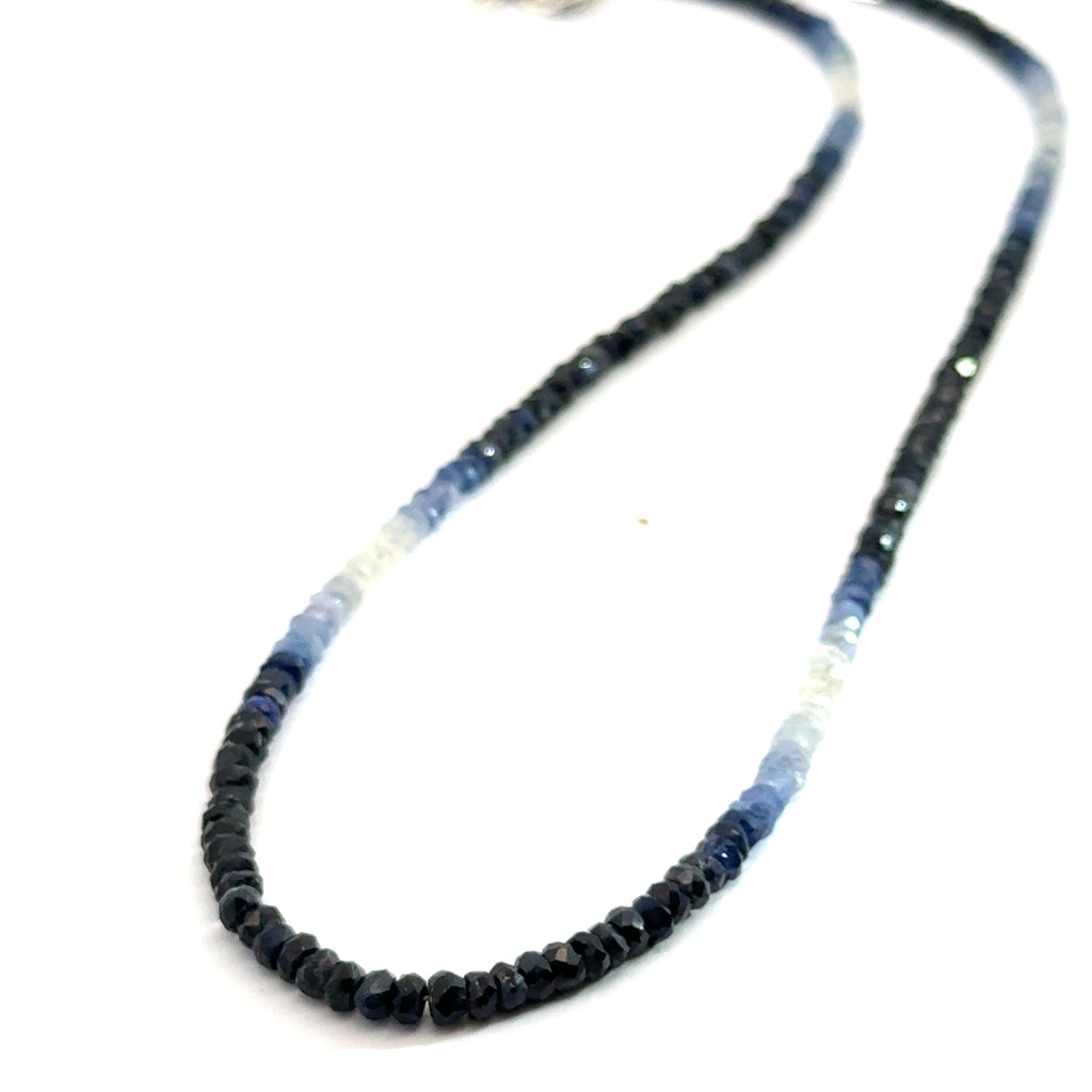 Genuine Sapphire gemstone necklace with a sterling silver toggle clasp by Hidden Jewel on a white background, long-hanging overview.