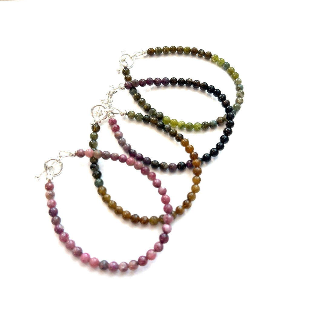 Genuine Watermelon Tourmaline Gemstone Bracelet on white grouping 4mm gemstone center overview