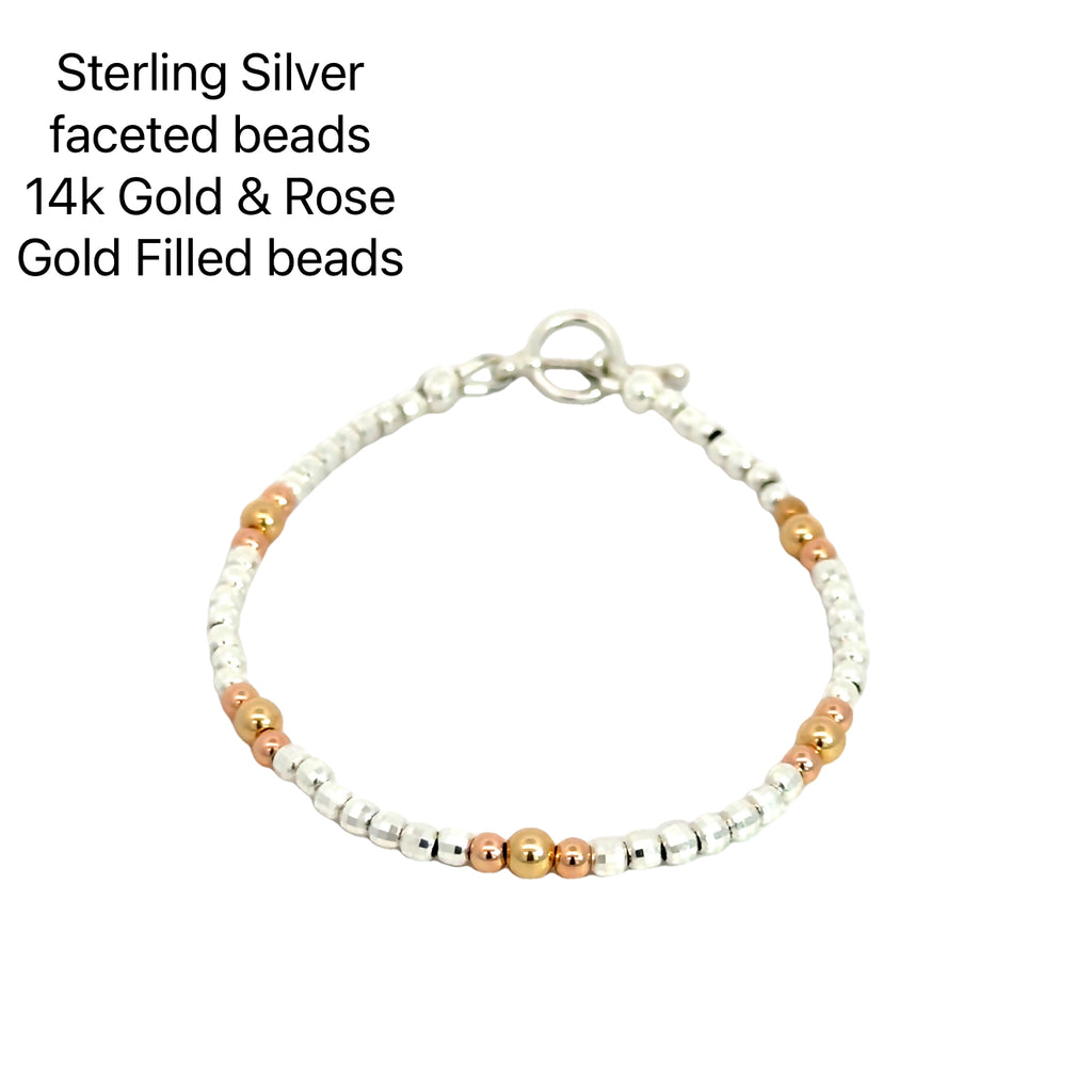 Gold, Rose Gold & Silver Faceted Bead Bracelet Sterling Silver with gold beads on white front overview