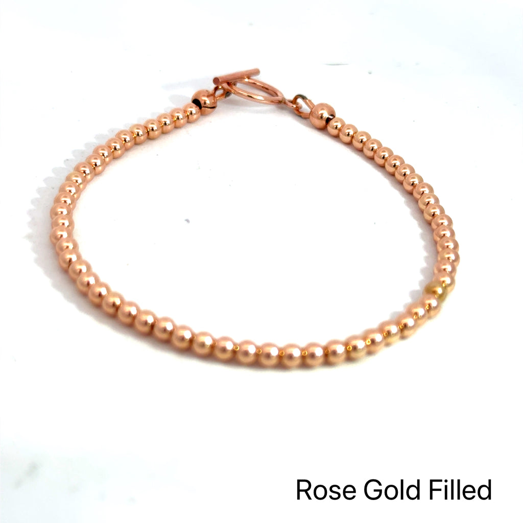 Gold, Rose Gold & Silver Faceted Bead Bracelet rose gold  on white front overview