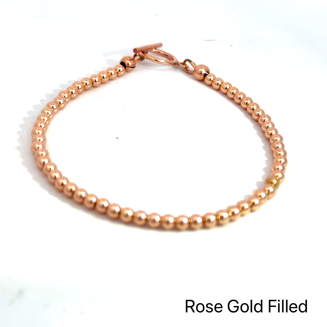 Gold, Rose Gold & Silver Faceted Bead Bracelet rose gold  on white front overview