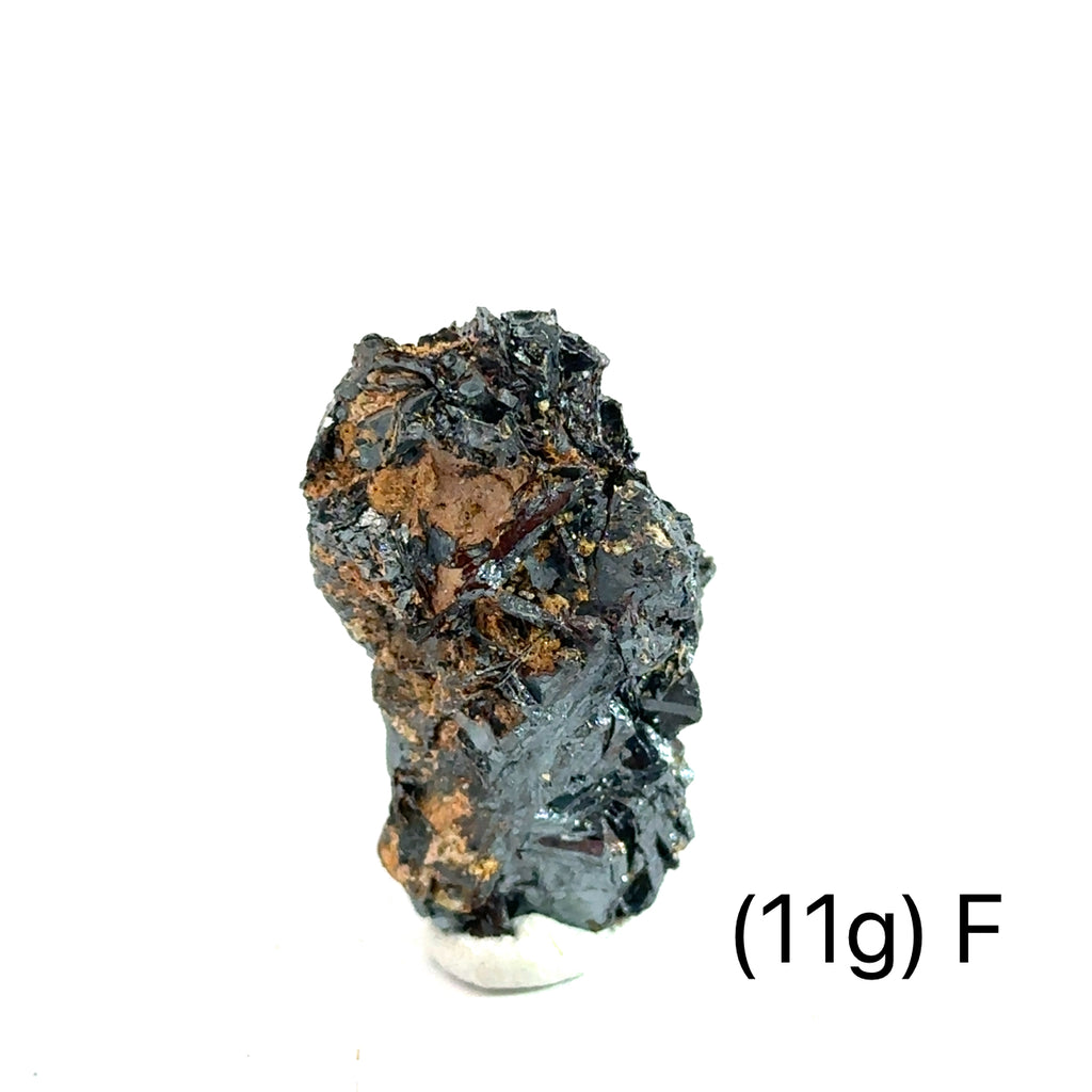 Golden Rutile with Hematite Raw Gemstone (11g ) F on white overview