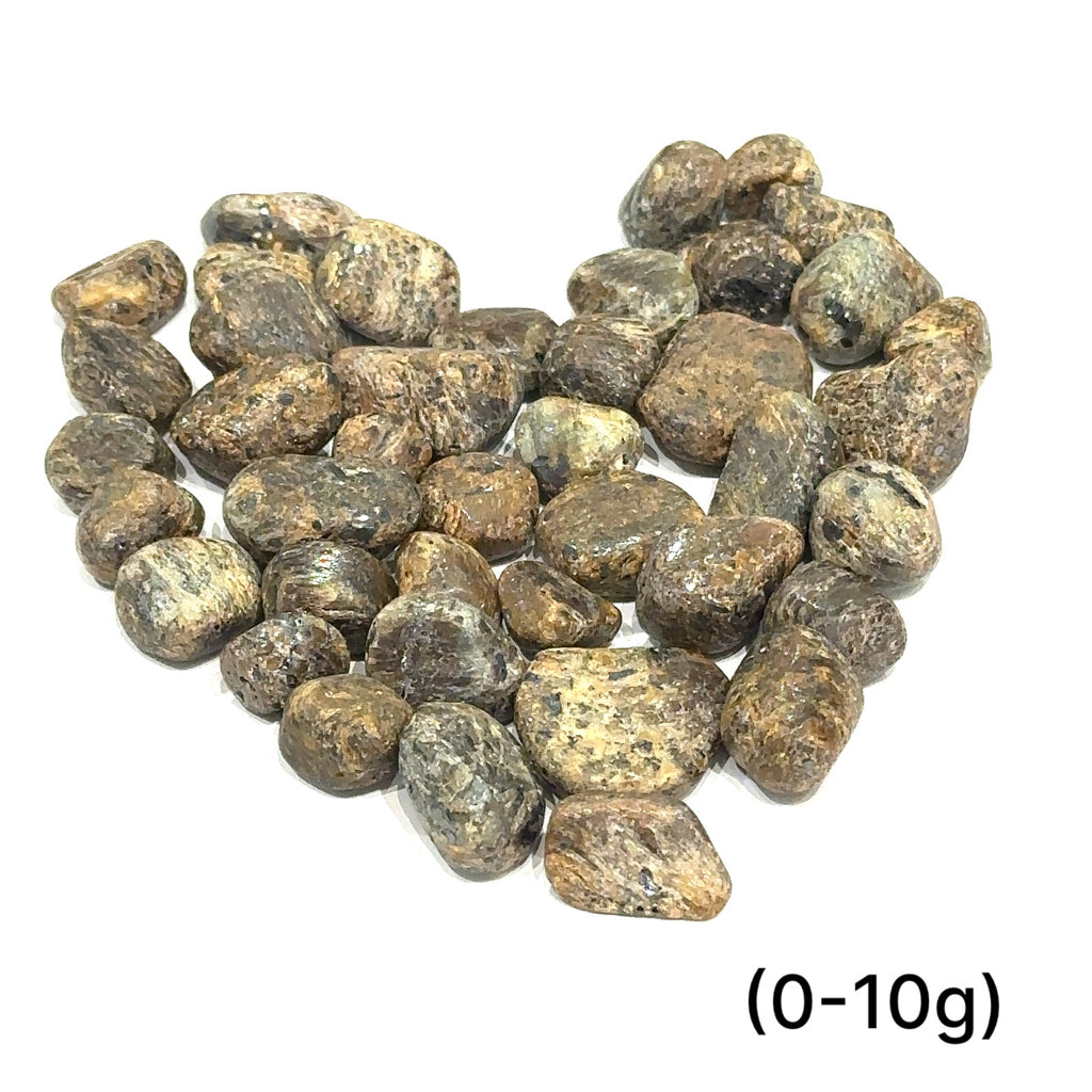 Golden Sapphire gemstone with bronze-golden shimmer symbolizing strength and success grouping of (0-10g) on white overview