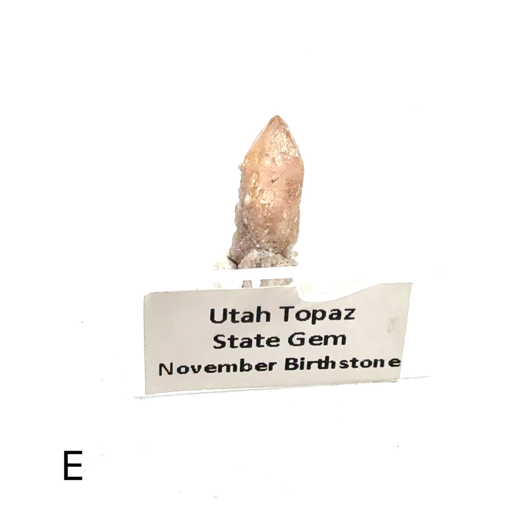 Golden Topaz Gemstone E on white front view