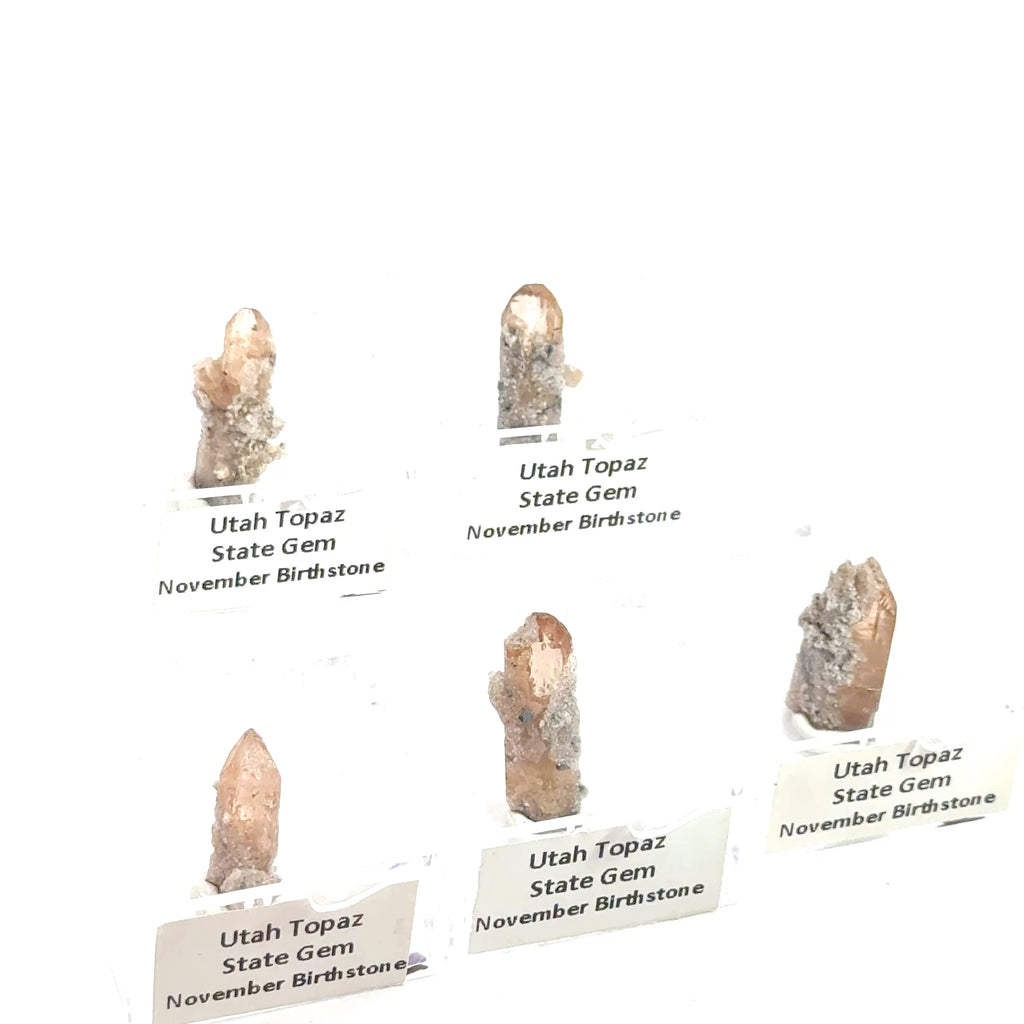 Golden Topaz Gemstone grouping on white front view