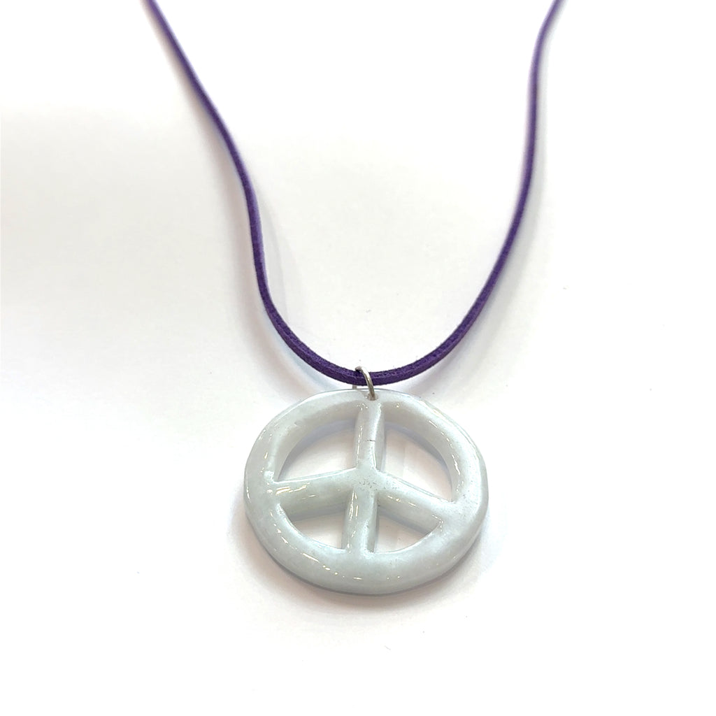 Green Jade Peace Symbol Pendant Necklace on white hanging center overview