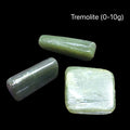 Green tremolite crystal on a black background with a weight of (0-10g), front view.