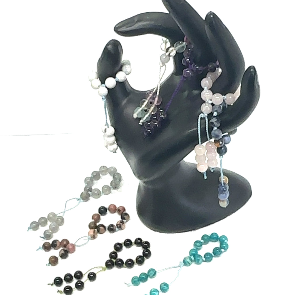 Hand-Knotted Mala Gemstone Rings grouping on white front view