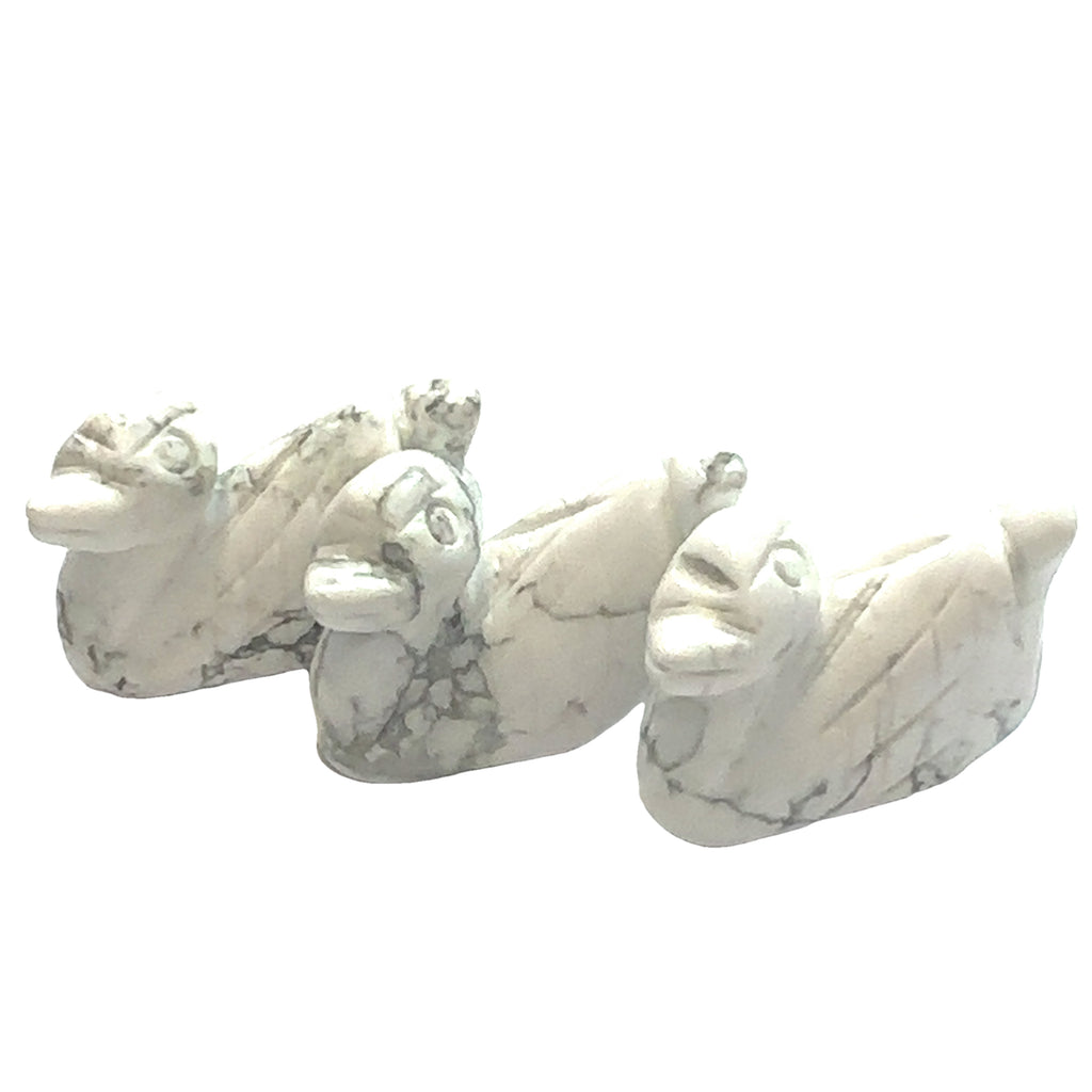 Hand-carved crystal ducky made from Howlite– healing stone for joy and creativity on white background front view