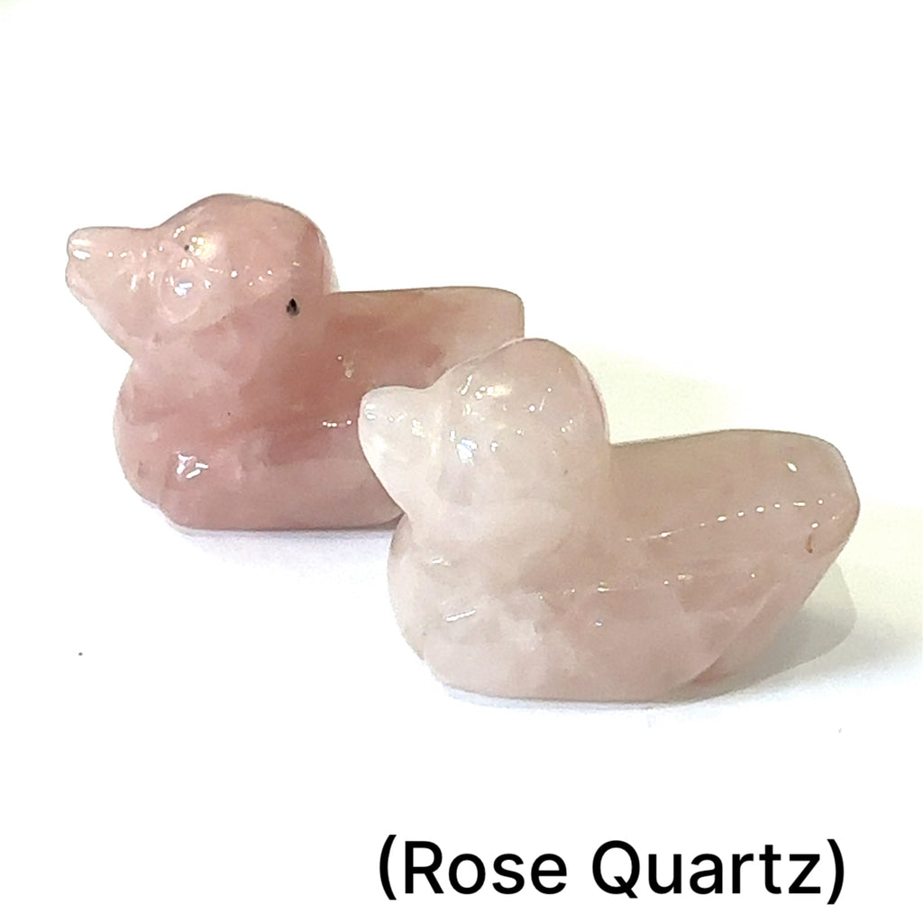 Hand-carved crystal ducky made from Rose Quartz – healing stone for joy and creativity on white background front view