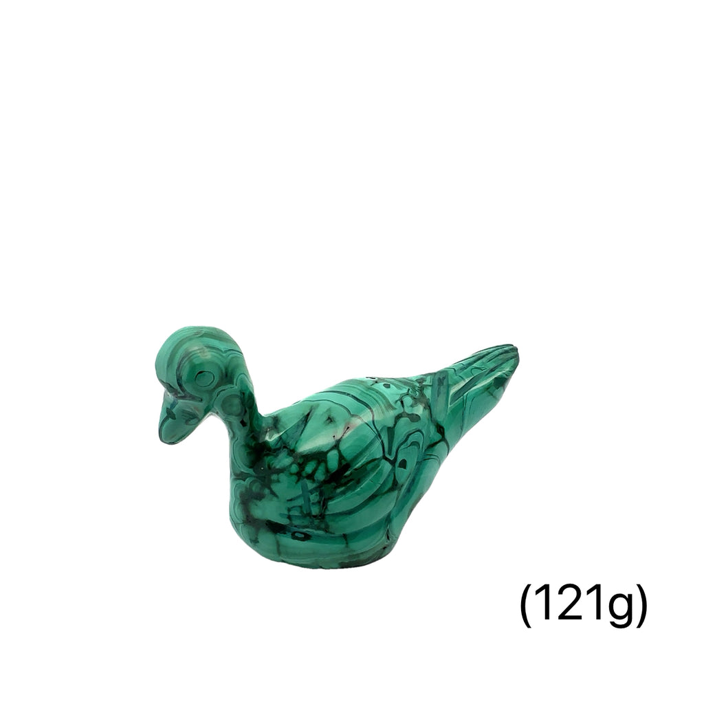 Hand-carved crystal ducky made from malachite– healing stone for joy and creativity on white background side view
