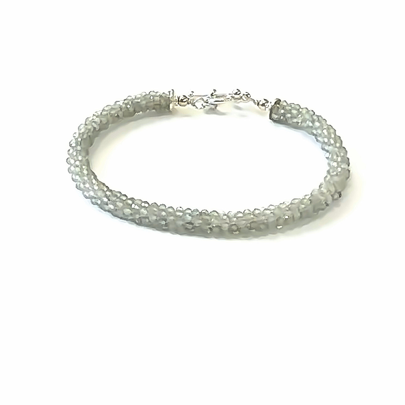 Handcrafted Labradorite gemstone bracelet with sterling silver toggle clasp on a white background, front, close up overview. 