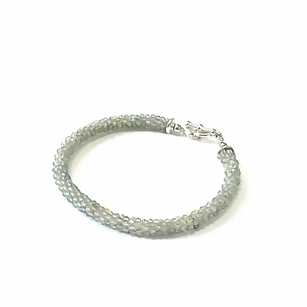 Handcrafted Labradorite gemstone bracelet with sterling silver toggle clasp on a white background, front, left angle, close-up overview. 