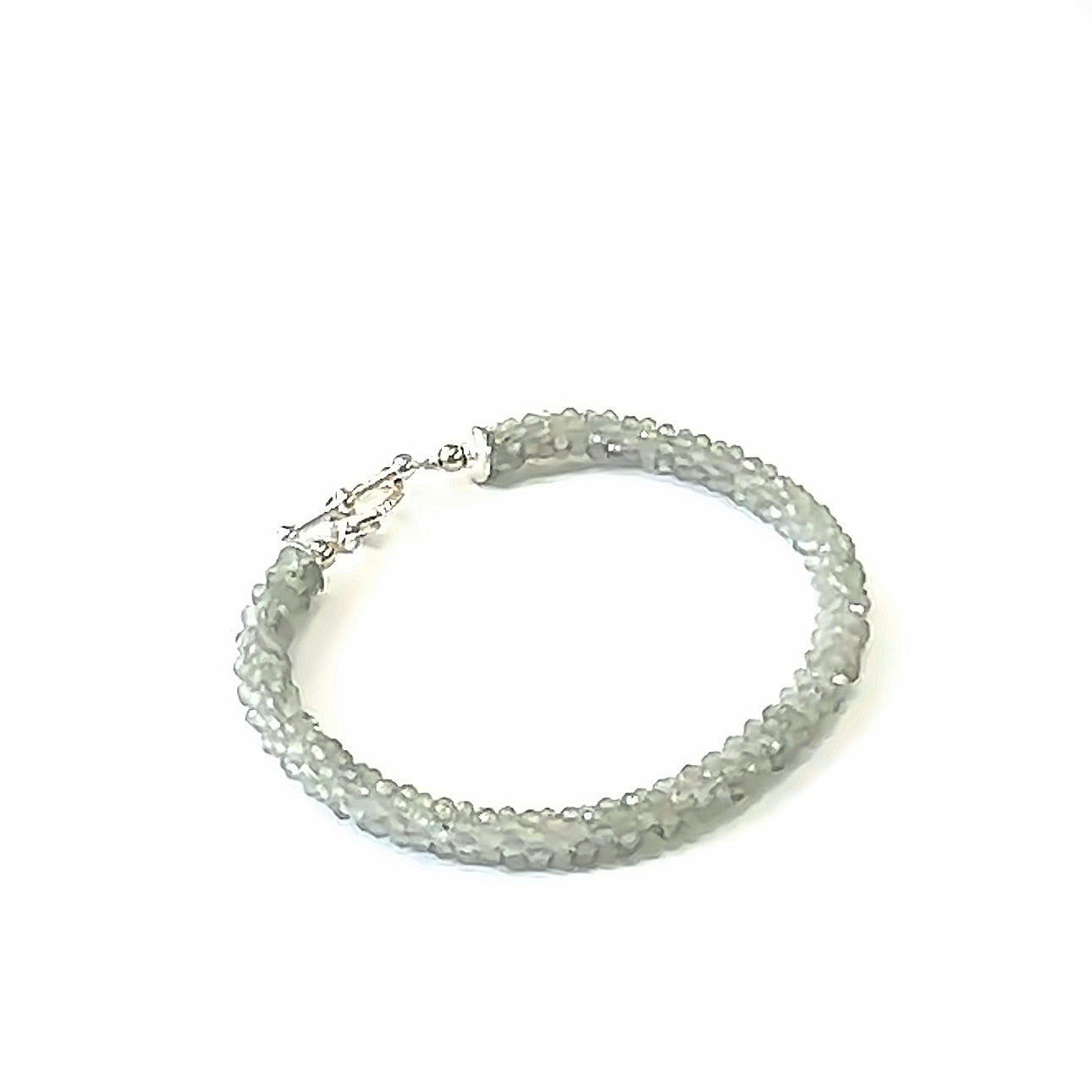 Handcrafted Labradorite gemstone bracelet with sterling silver toggle clasp on a white background, front left angle overview. 