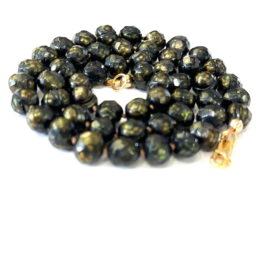 Handcrafted black freshwater pearl necklace perfect for layering or gifting on white spiral view