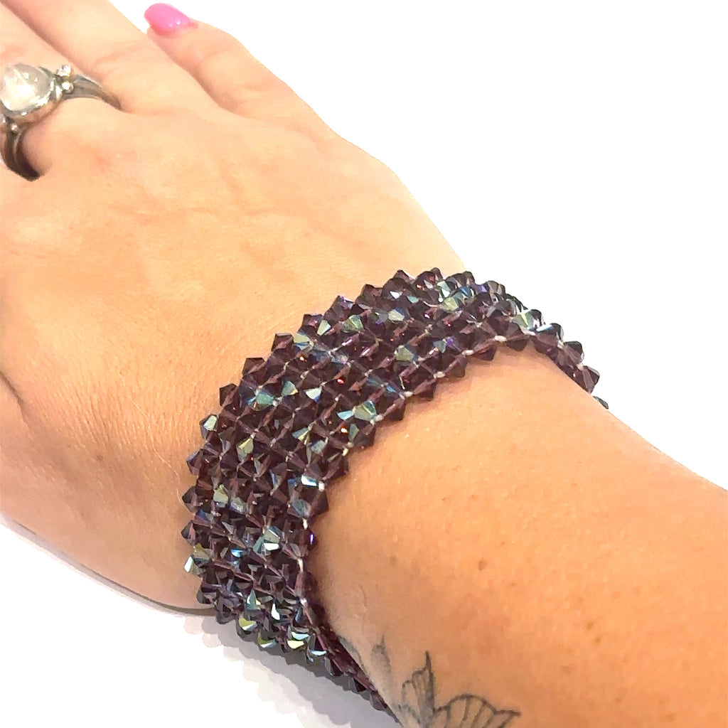 Handcrafted purple crystal cuff bracelet for glamour, intuition, and self‑expression on white and on wrist view of front of cuff