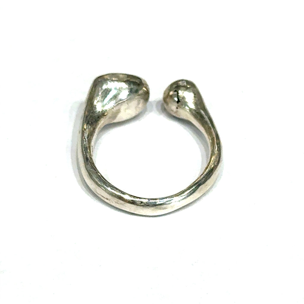Handcrafted sterling silver bubble ring with clear CZ accents — open shank design a close up view of the back on a white background.