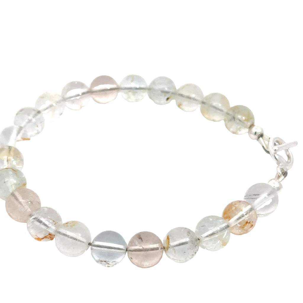 Handmade Blue Topaz gemstone bracelet with sterling silver toggle clasp, November birthstone jewelry on white left side overview