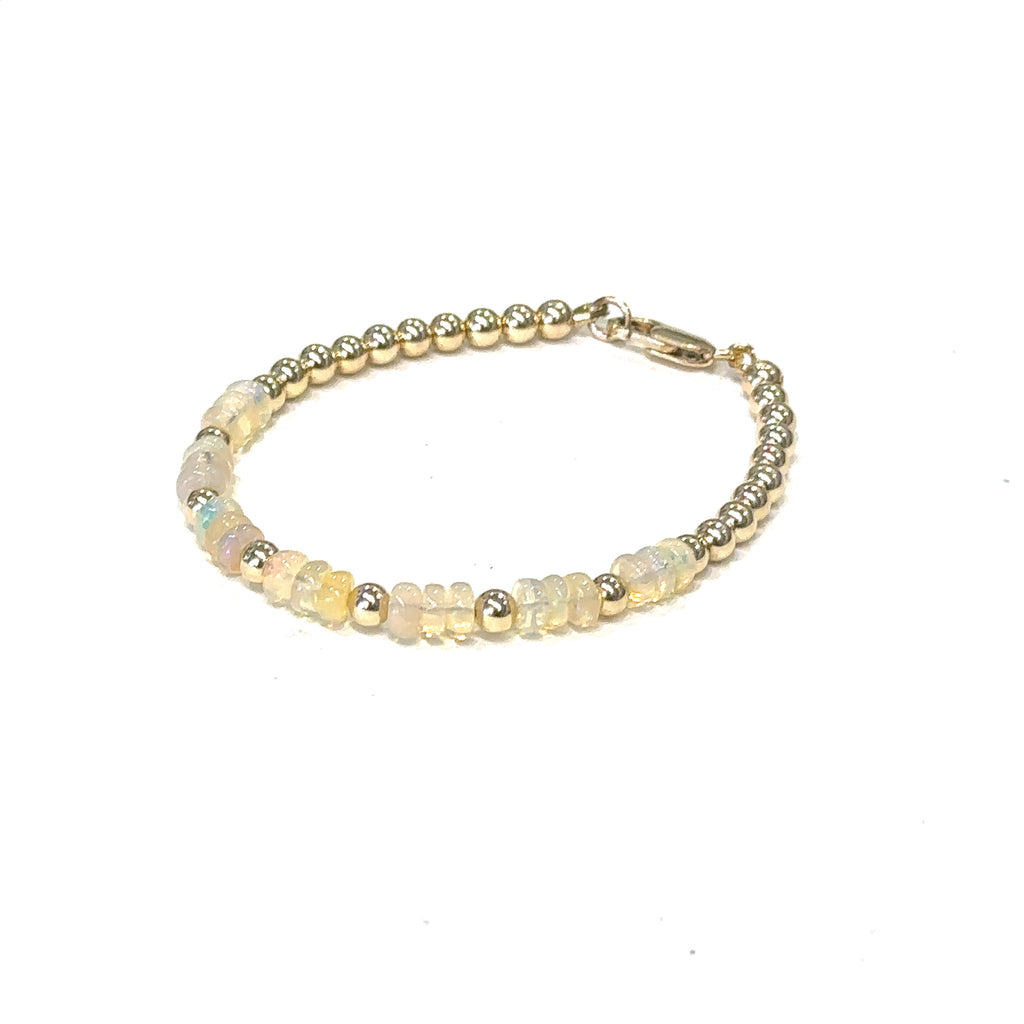 Handmade Ethiopian Opal bracelet perfect for stacking or everyday wear (gold filled beads & opal ) on white left angle front view 