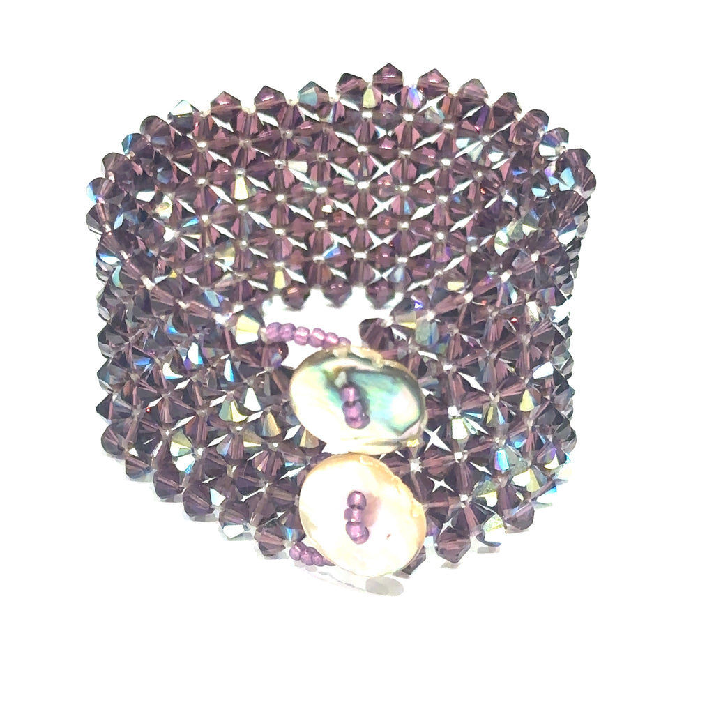 Handmade Purple Swarovski Crystal cuff bracelet with Abalone shell button clasp, 7.25'' long on white standing up cuff back view