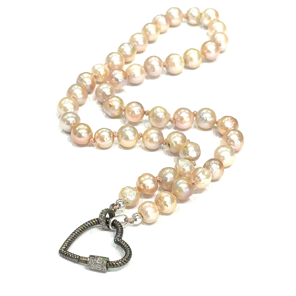 Handmade knotted Akoya pearl necklace with oxidized sterling silver heart clasp and pave diamonds on white heart clasp overview