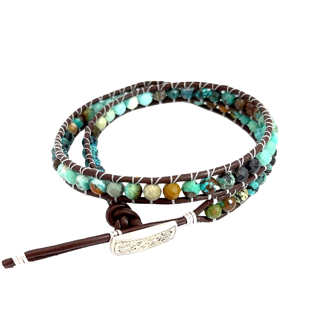 Handmade turquoise gemstone bracelet with leather wrap design for calmness and communication on white back view