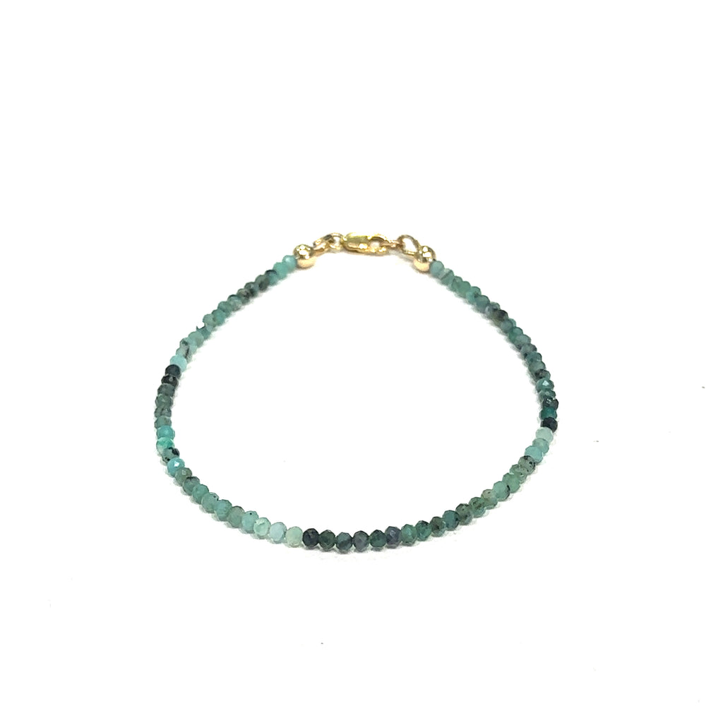 Healing Emerald gemstone bracelet handcrafted in Boston, Massachusetts on white overview