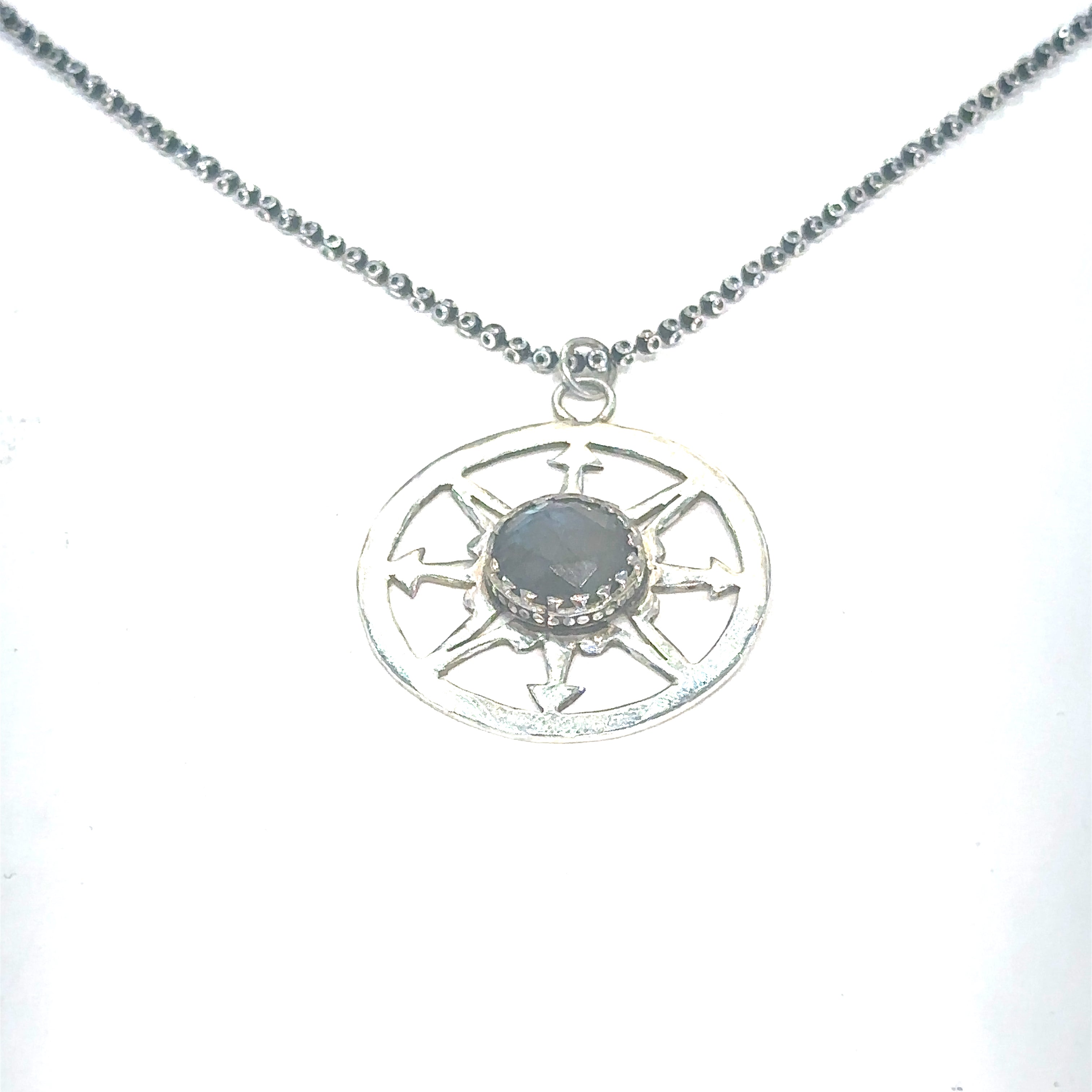 Healing Labradorite compass pendant necklace for chakra alignment and spiritual connection on white center long hanging overview