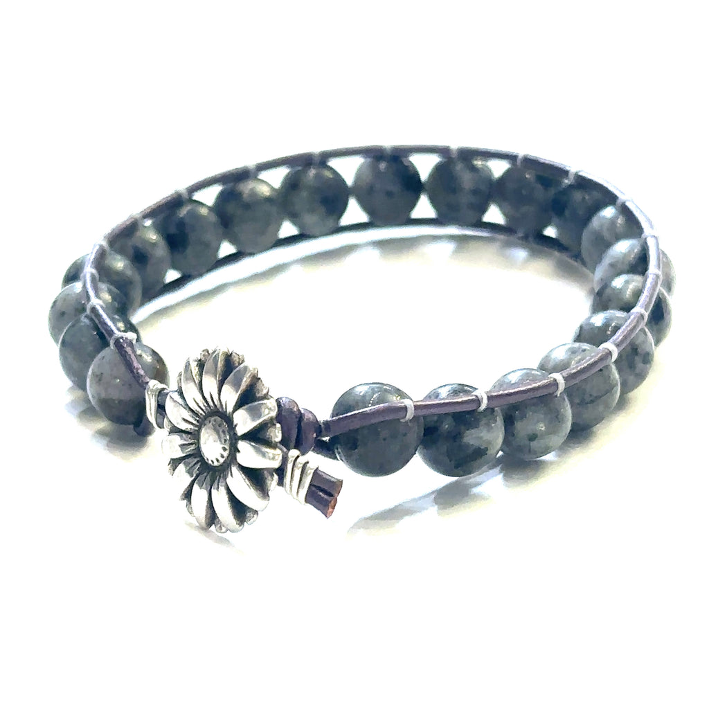 Healing Larvikite crystal bracelet for grounding and aura cleansing on white left bottom angle view