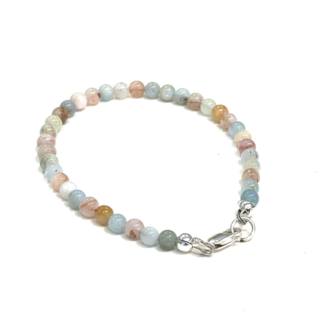 Healing Morganite gemstone bracelet for romance, peace, and emotional balance on white back overview 