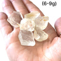 Healing White Topaz crystal for mental clarity, spirituality, and psychic gifts, grouping of gemstones (6-9g)  in hand to show a close-up overview