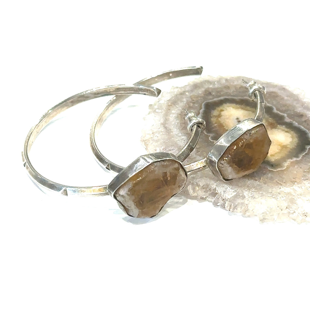 Healing crystal citrine earrings with sterling silver ear wires on white  center close up overview