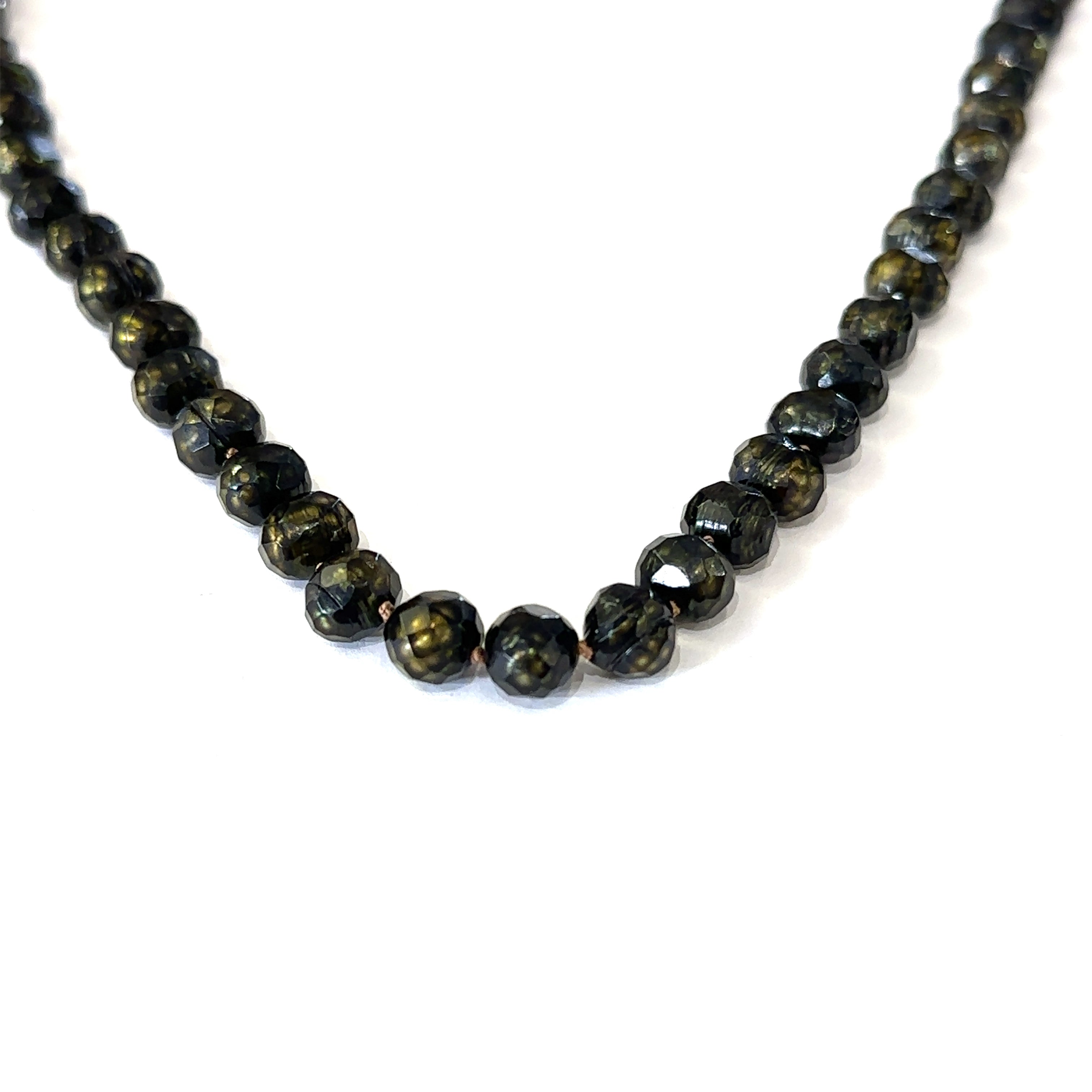 Healing freshwater pearl necklace with 7mm faceted irregular round pearls on white hanging center overview