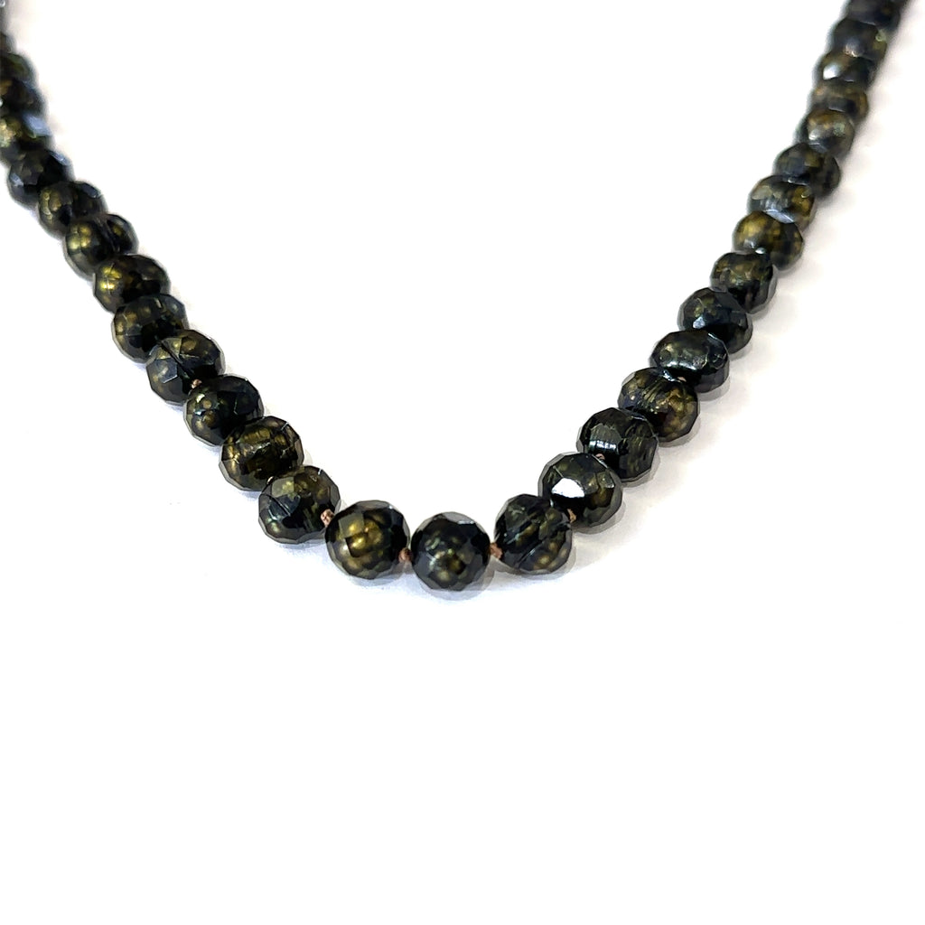 Healing freshwater pearl necklace with 7mm faceted irregular round pearls on white hanging center overview