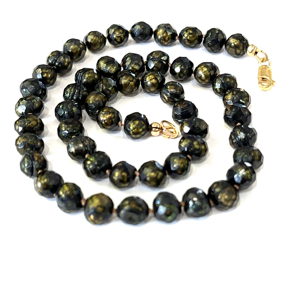 Healing freshwater pearl necklace with 7mm faceted irregular round pearls  on white spiral center view