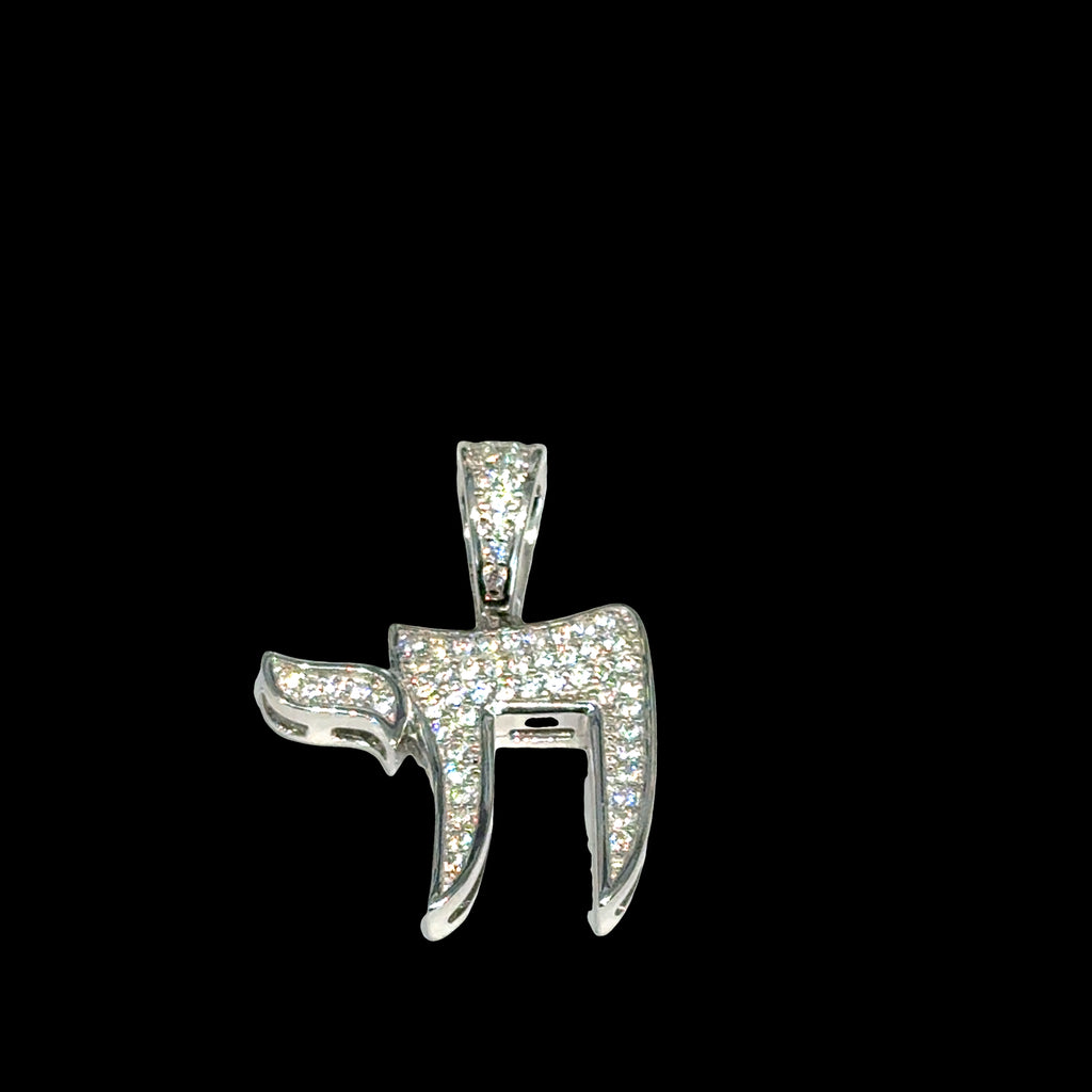 Hebrew Chai life symbol pendant in polished sterling silver with paved CZ detail on a black background, front overview. 
